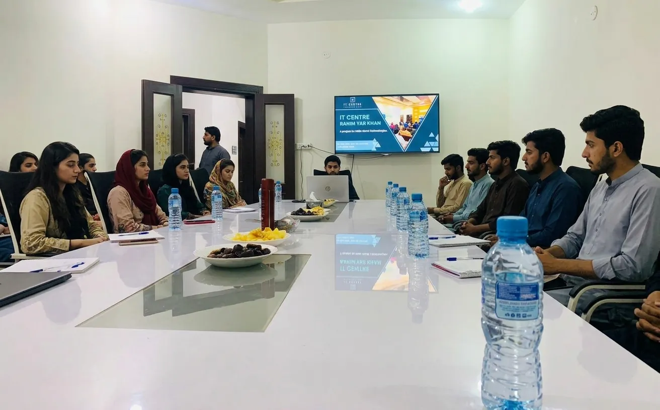 Training session around the conference table at ICR IT Centre, Rahim Yar Khan